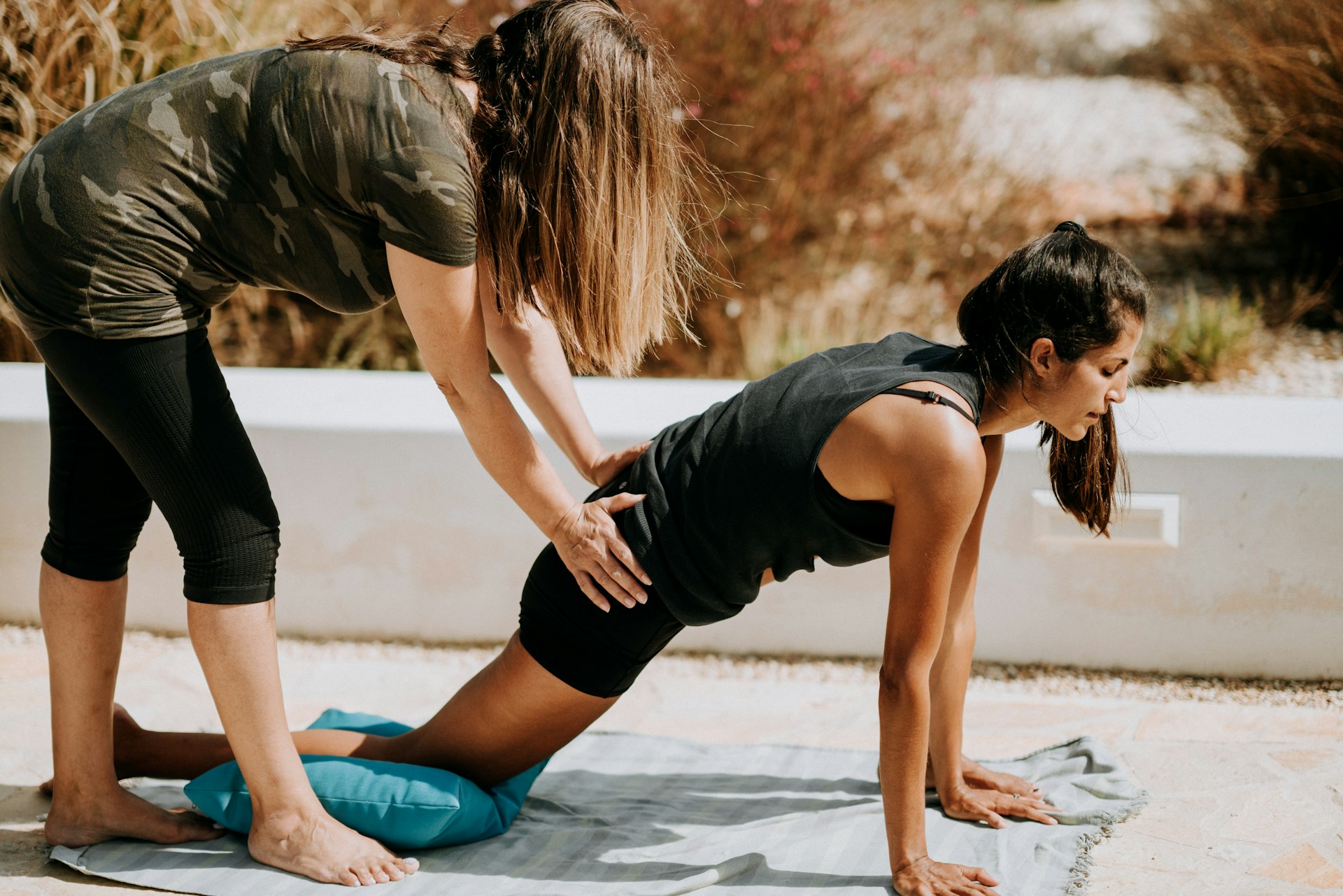 Individual stretching their legs, highlighting exercises that enhance knee flexibility and reduce stiffness