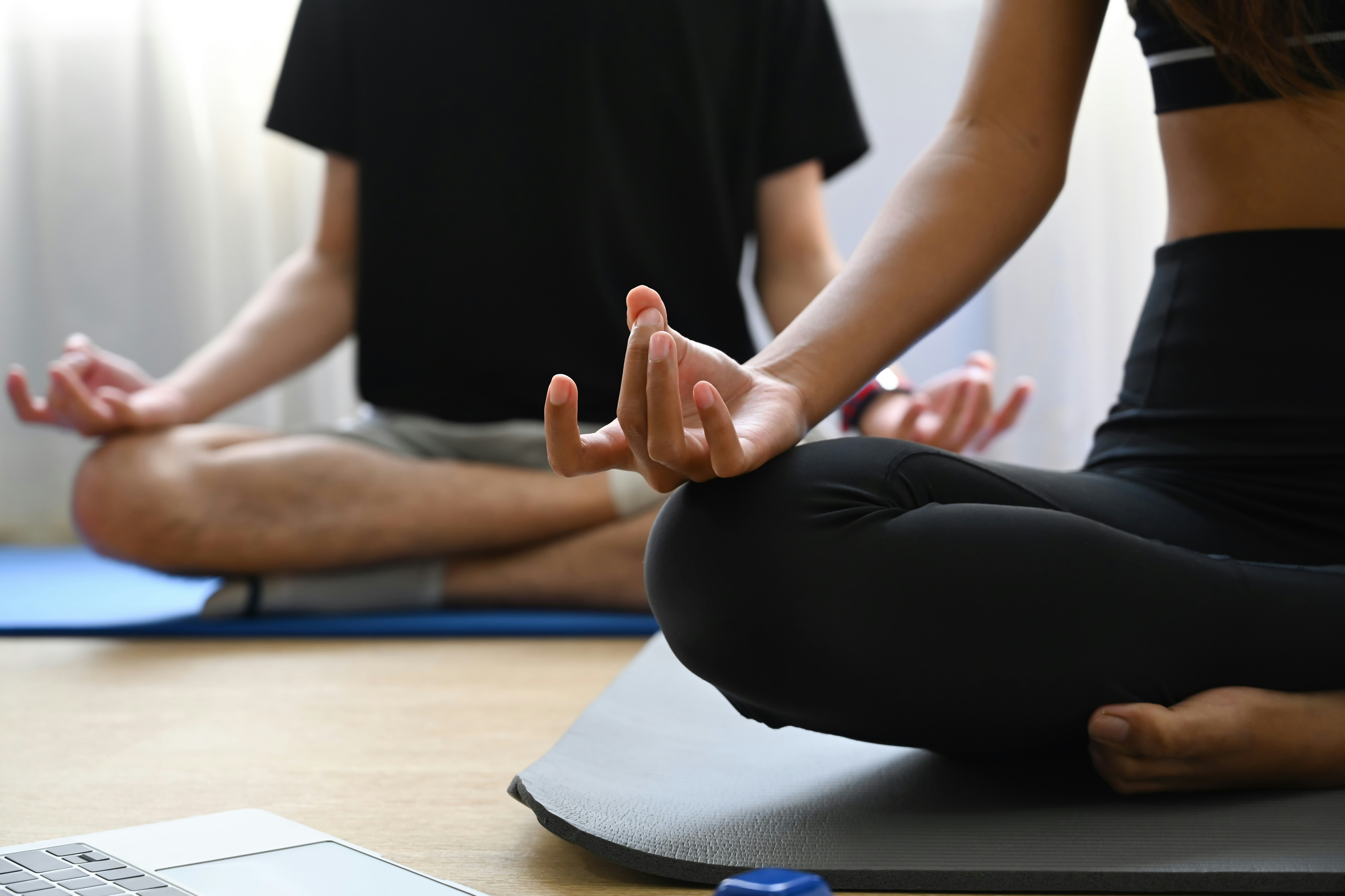 A person performing Surya Namaskar, a sequence of yoga poses for full-body workout and weight loss, increasing heart rate and enhancing metabolism.