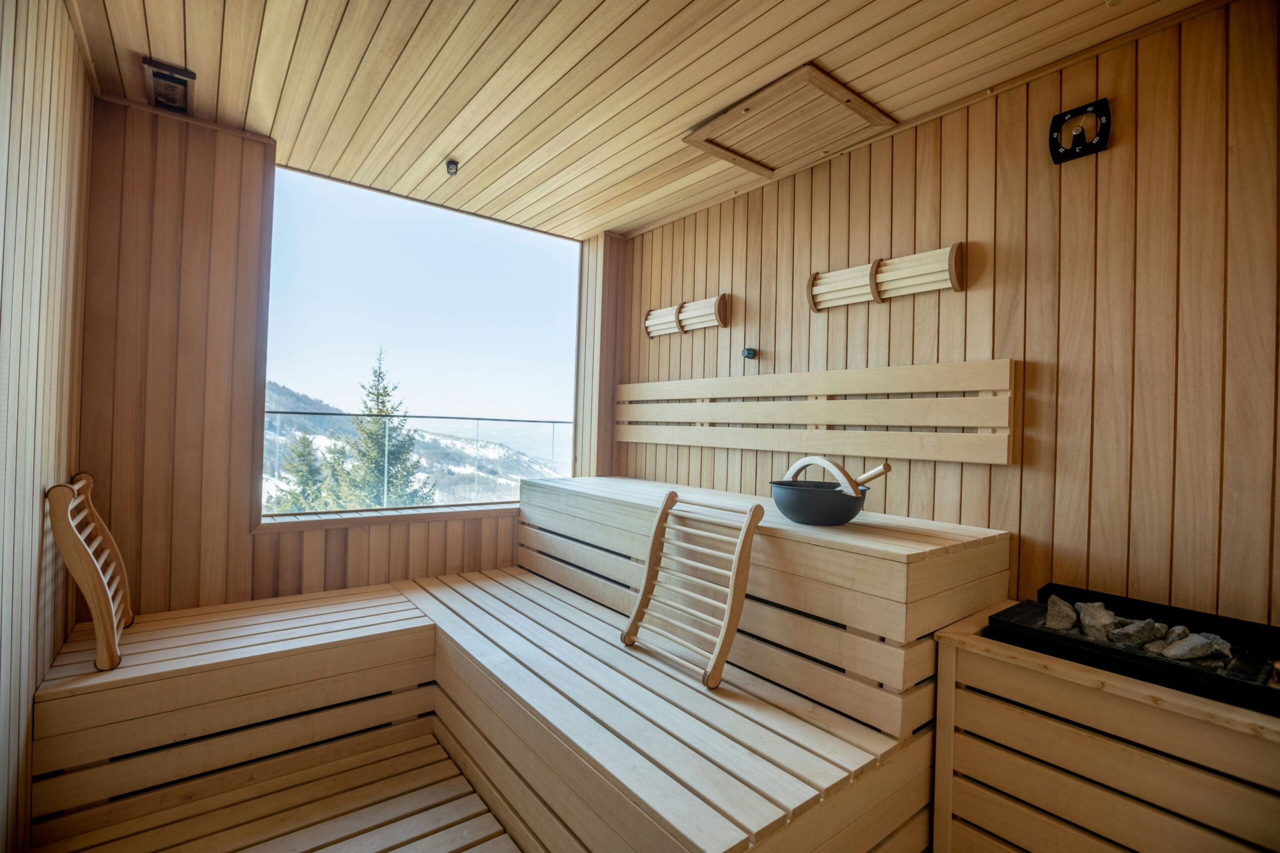 Image of a traditional wooden sauna, emphasizing its high-temperature and low-humidity environment for detoxification and cardiovascular health