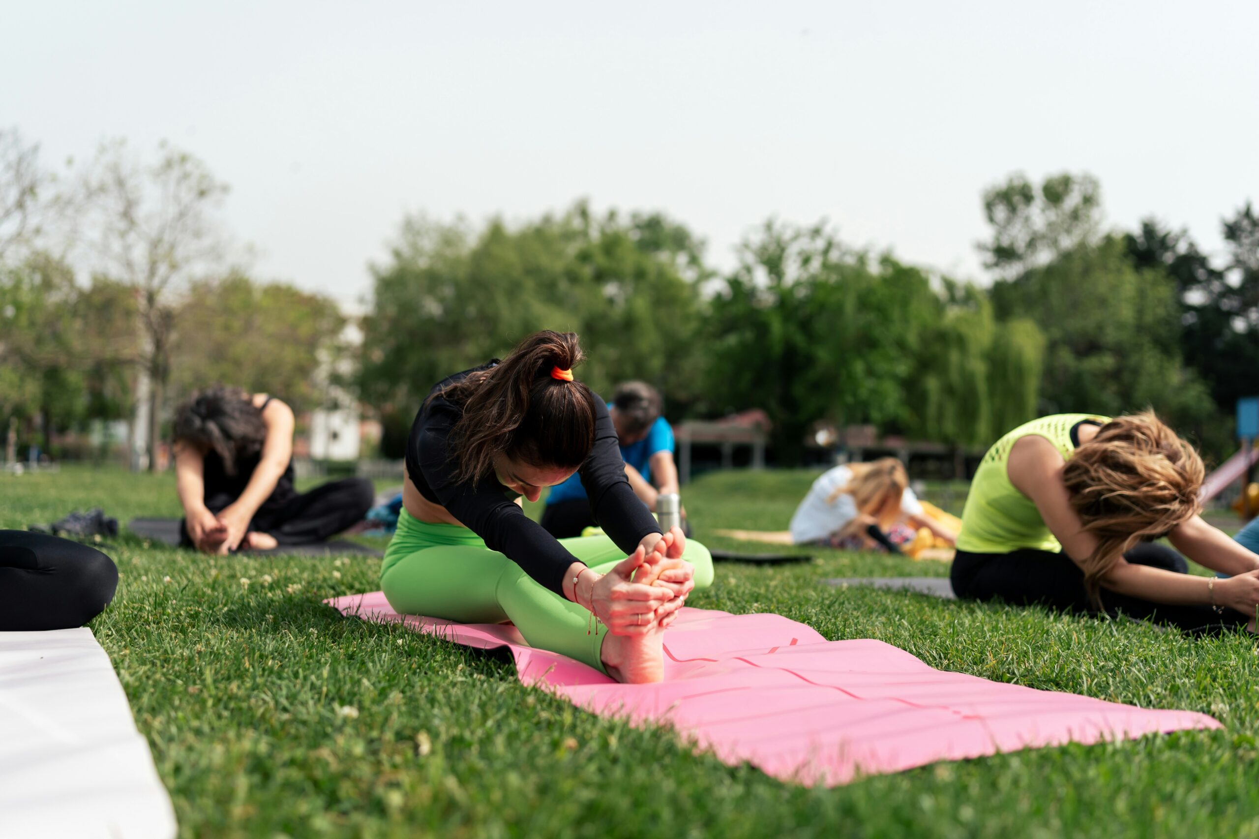  Person practicing Locust Pose, lifting chest and legs off the ground, engaging back muscles and promoting core stability.