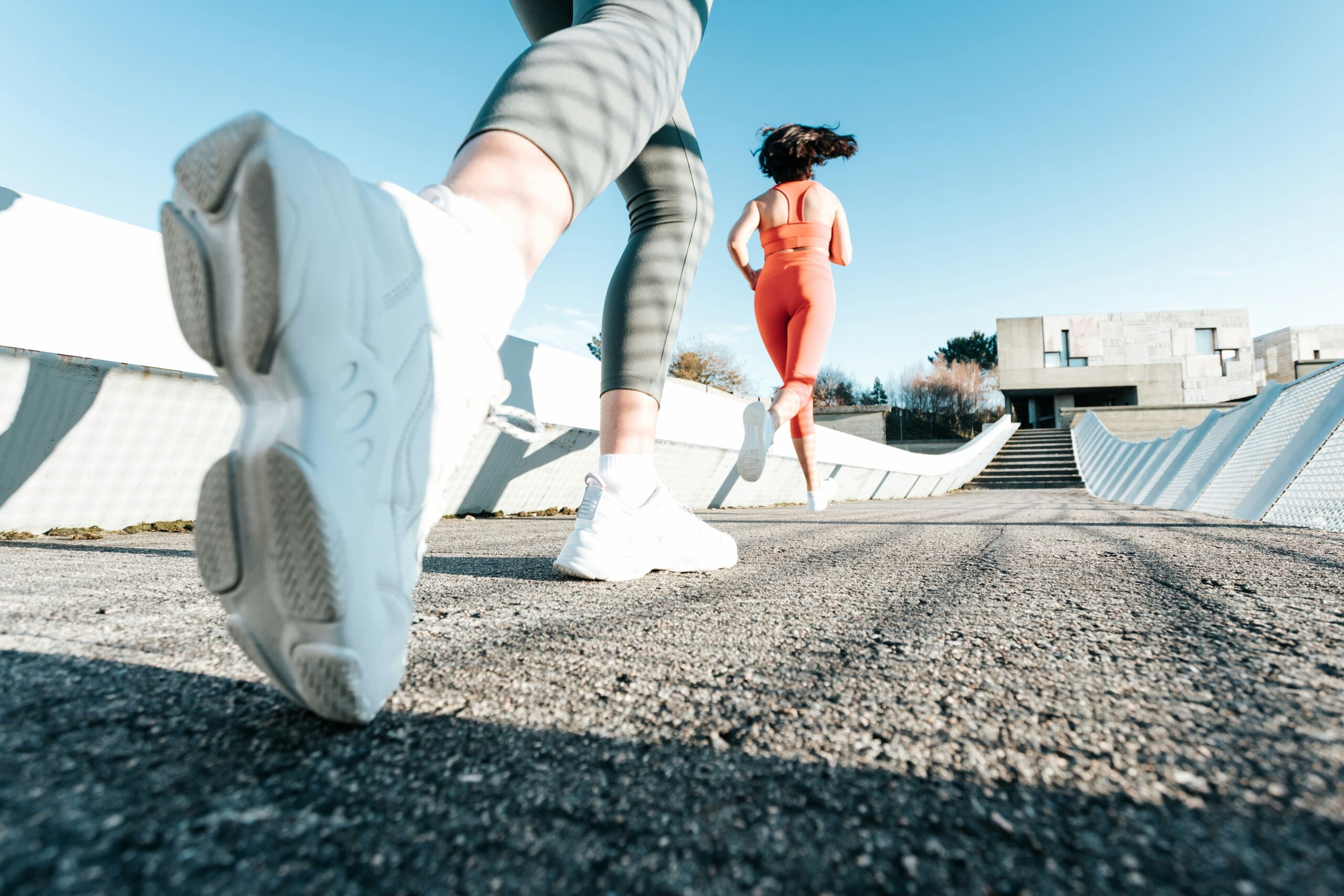 Person running outdoors on a trail, representing the importance of cardiovascular endurance for heart health and fitness improvement.